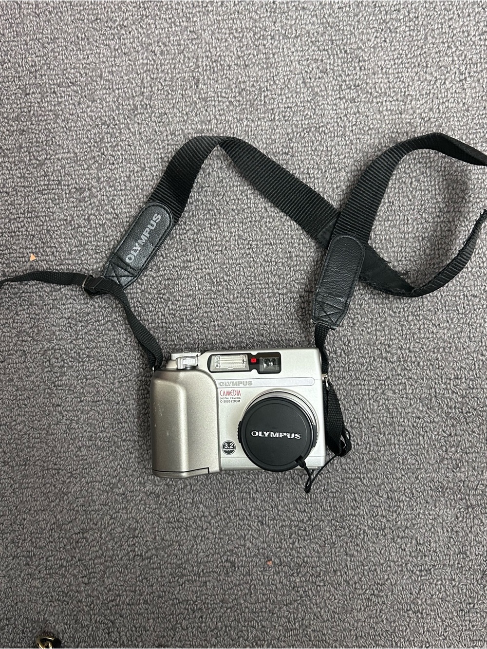 Olympus Silver Compact Digital Camera with Black Strap